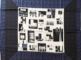 an image of a blue and black scarf with black and white images on it