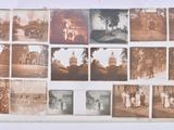 an old photo of a bunch of old photos on a wall