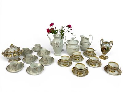 many different types of teapots and saucers on the table
