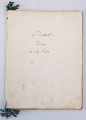 an old book with writing on it sitting on a table