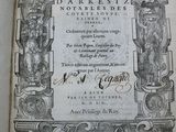 an old book with a black and white drawing on it