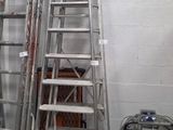 a ladder that is leaning against a wall next to a keg