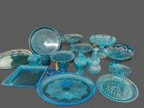 many pieces of blue glass on the table