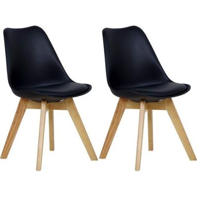 paire de chaises de salle à manger en cuir noir avec des pieds en bois
