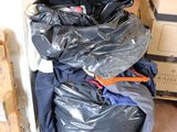 a pile of garbage sitting in the corner of a room