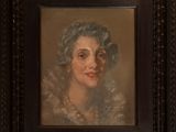 portrait of a woman in a fur collar, in a black frame