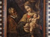 un vieux tableau représentant un homme tenant un bébé dans ses bras