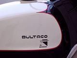 a close up of a motorcycle with a red and white stripe