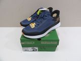 a pair of blue sneakers sitting on top of a green box