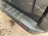 a close up of a car ' s door handle and side steps