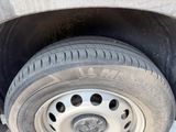 a tire that is sitting on the side of the road
