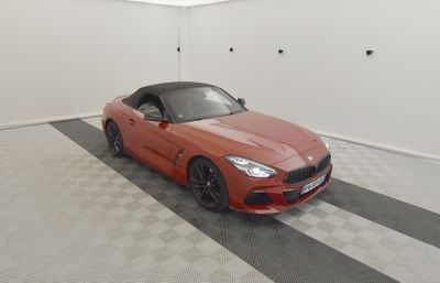 an image of a red sports car parked in a garage