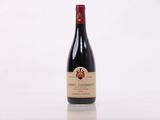 a bottle of wine that is sitting on a table