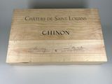 a wooden box with a label on it that says chateau saint louis chinon