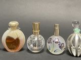 several different types of perfume bottles lined up in a row