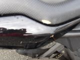 a close up of a motorcycle with a black seat