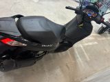 a scooter that is parked in a parking lot
