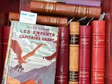 many books in a red box on the table