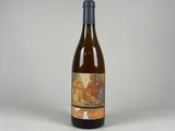 a bottle of wine that is sitting on a table