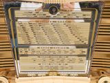 a very old radio with a lot of information on it