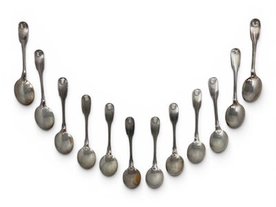 an assortment of silver spoons and spoon spoons on a white surface