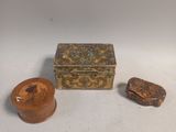 two small wooden boxes and a small wooden box on a white surface