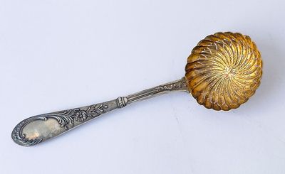antique silver plated spoon with a flower design on the handle
