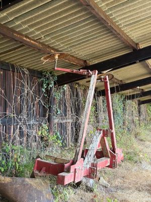 a red ladder that is leaning against the side of a building