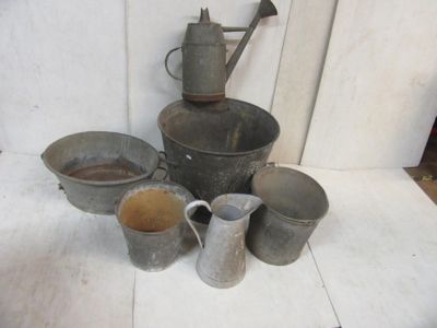 many pots and pans that are sitting on a table