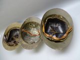 three helmets that are sitting on a table