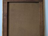 an old picture frame with a piece of wood in it