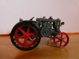 a toy tractor that is sitting on a table