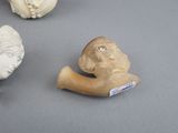 four figurines of different shapes and sizes on a table
