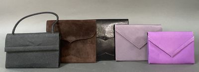 several different colored envelopes are lined up on a table