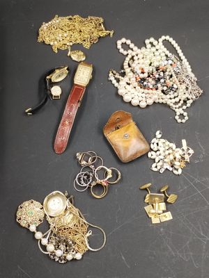 many different types of jewelry on a table