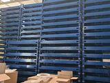 pallets in a warehouse with boxes stacked on top of them