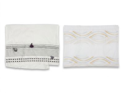 a white towel and a black and white towel on a white background