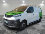 the white and green van is parked on a checkered floor