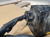 a black blow dryer sitting on top of a cardboard box