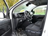 the interior of a white truck with the driver ' s seat up