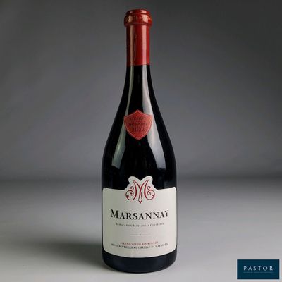 a bottle of wine that is sitting on a table