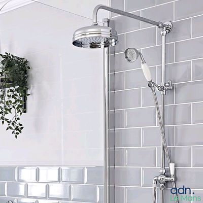 a bathroom with a shower and a sink in it