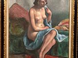 une peinture à l'huile représentant une femme nue assise sur un canapé