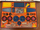 an orange and blue box with a bunch of different items