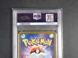 the pokemon card is in a clear plastic holder on a table