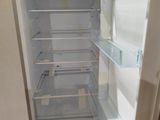an open refrigerator with the door open in a kitchen