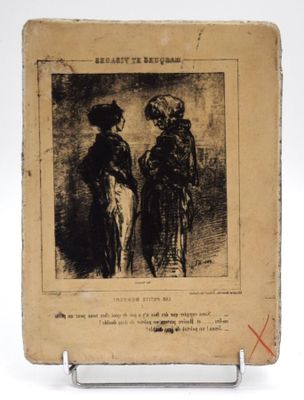 un vieux livre sur lequel figure une image représentant deux femmes côte à côte