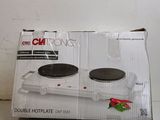 packaging of a white electric stove top sitting on top of a counter