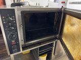 a toaster oven that is open on the counter