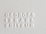 a close up picture of a white wall with words on it